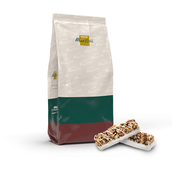 Vrećica Master Martini sa zeleno-crvenom etiketom pored dvije granola pločice s bijelom čokoladom